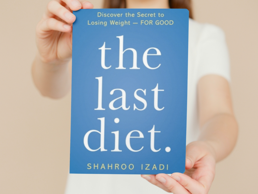 En pige som holder bogen: "The last diet"
